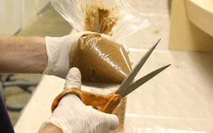 Trimming the corner of the epoxy filleting bag